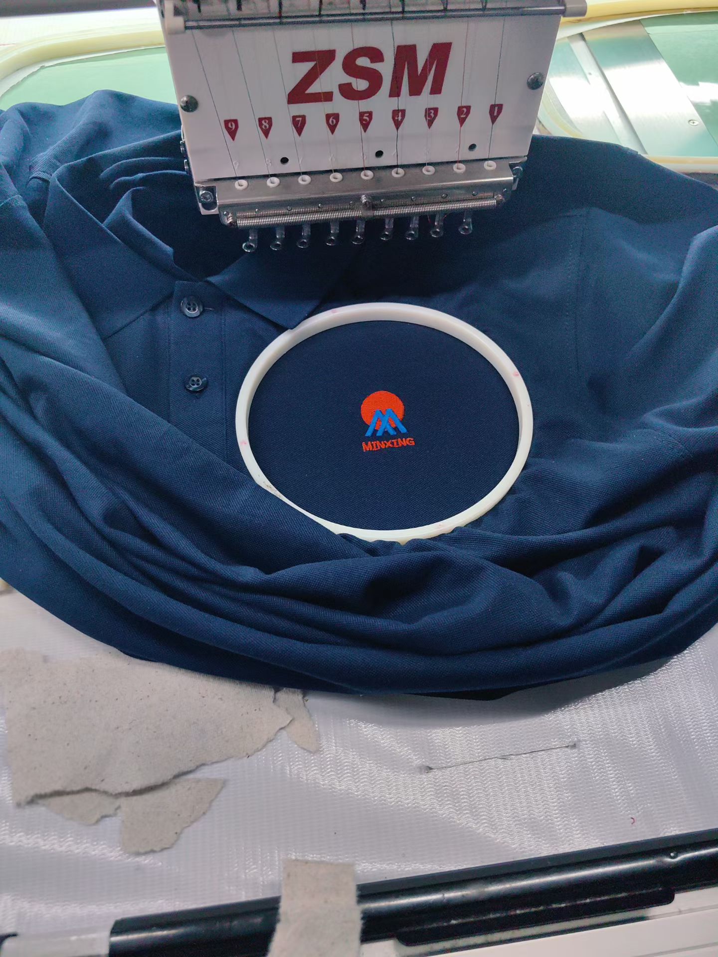 Custom professional embroidery work on uniform polo shirt, Perth WA business workwear branding